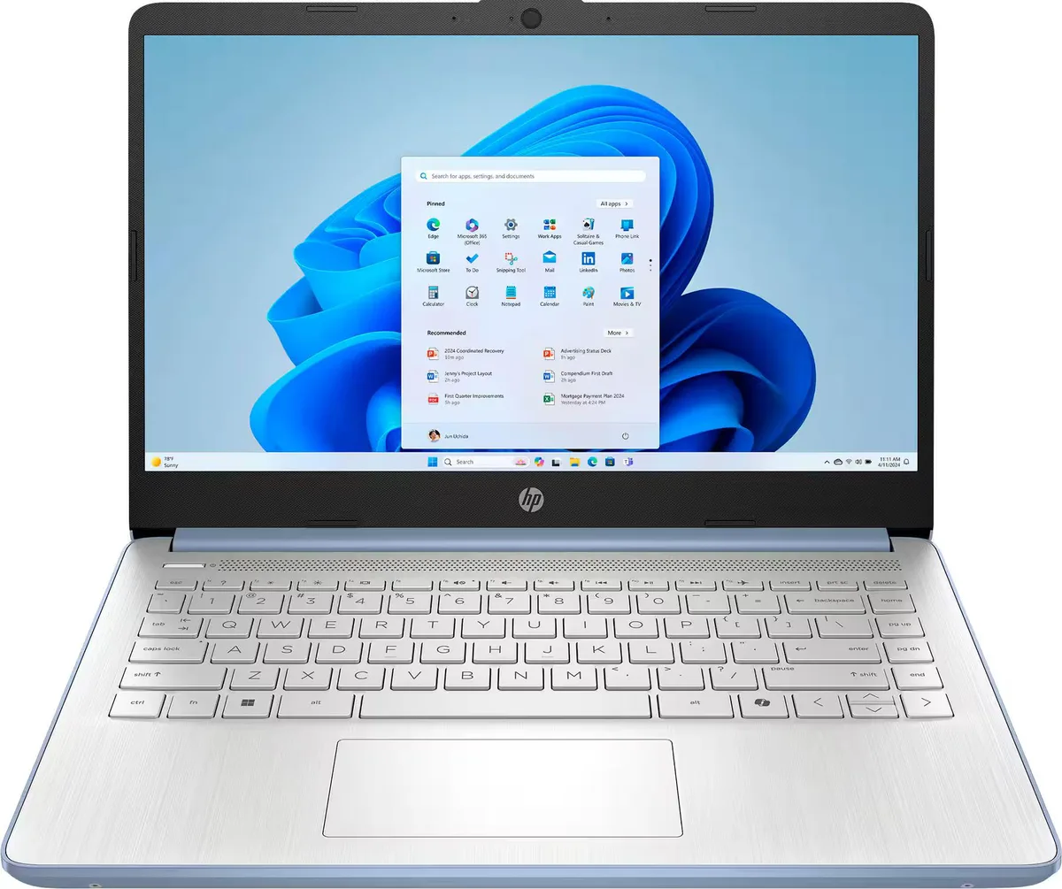 Blue 14 inch HP laptop closed on a plain surface