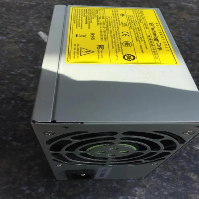 Rectangular black ATX power supply unit with gold efficiency badge and cooling fan grille