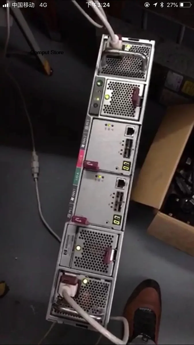 Rectangular ATX power supply unit with metal casing and cooling fan grille