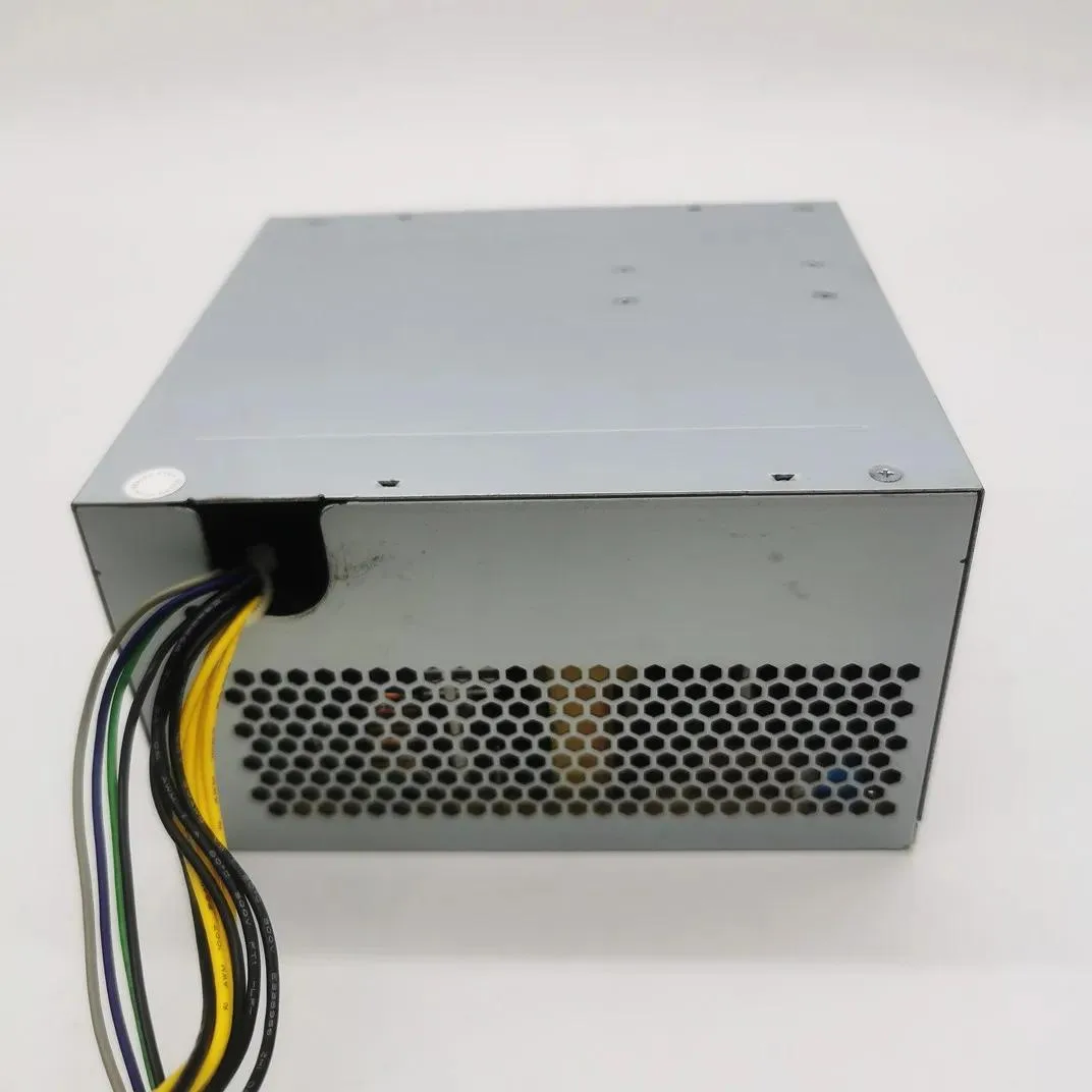 Black ATX power supply unit with ventilation grille and cable bundle