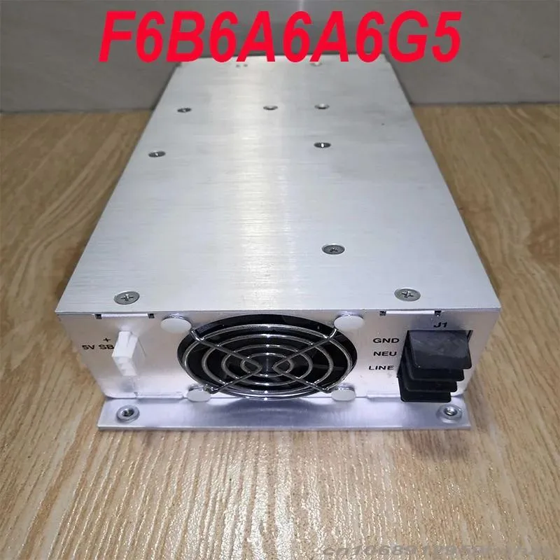 Rectangular ATX power supply unit with matte black metal casing and rear fan grille