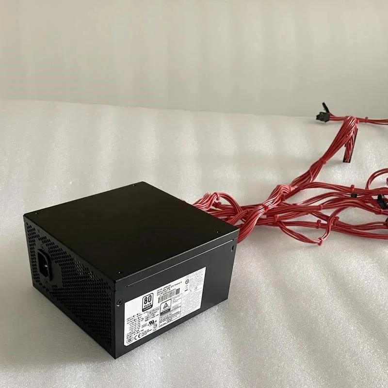 Rectangular black ATX power supply unit with cooling fan and modular cable connectors