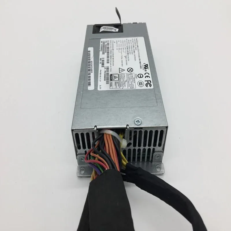 Compact silver ATX power supply unit with rear fan grille and cable bundle