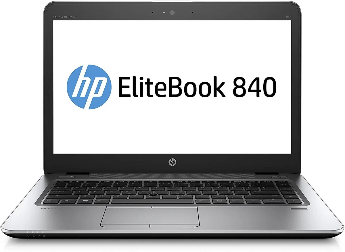 Silver 14 inch laptop closed on a plain background