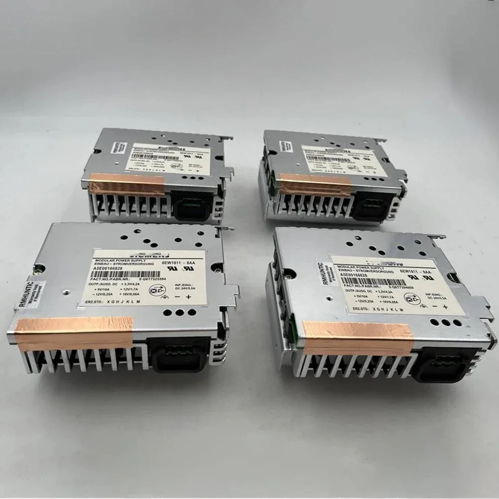 Silver rectangular ATX power supply unit with ventilation grille and label
