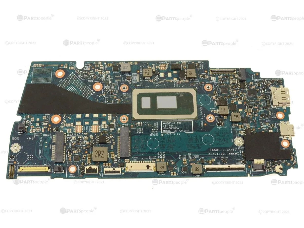 Green laptop motherboard with silver CPU socket and black memory chips