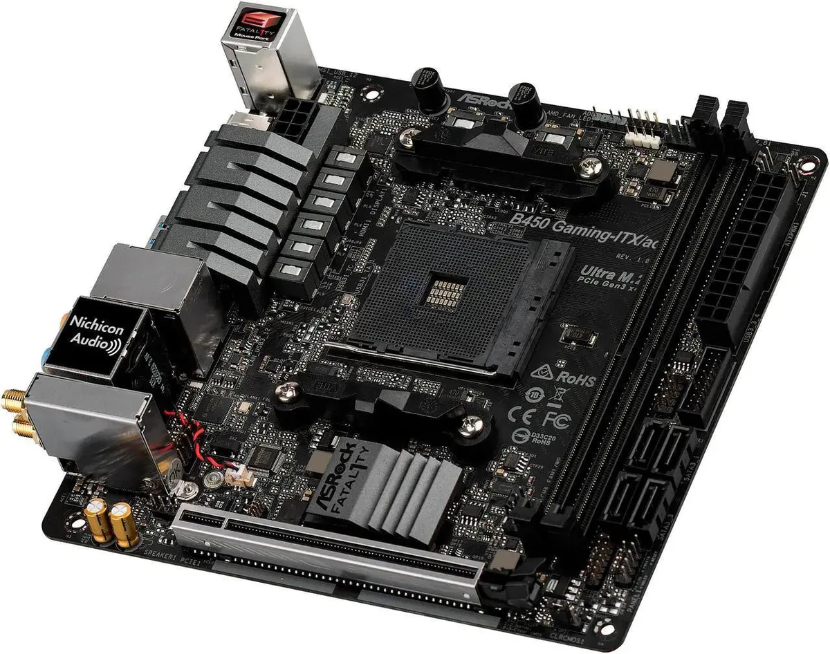 Square Mini-ITX board, black PCB with silver heatsinks and a gold PCIe slot