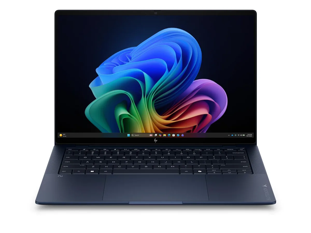 Silver 14-inch laptop with 3K OLED touchscreen, thin tapered profile
