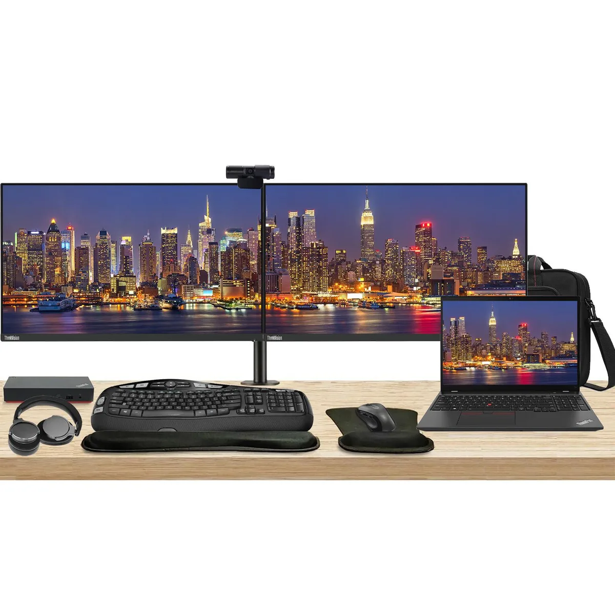 Open laptop with 16 inch touchscreen beside two 24 inch monitors on a dual stand, USB-C dock, wireless keyboard and mouse, webcam