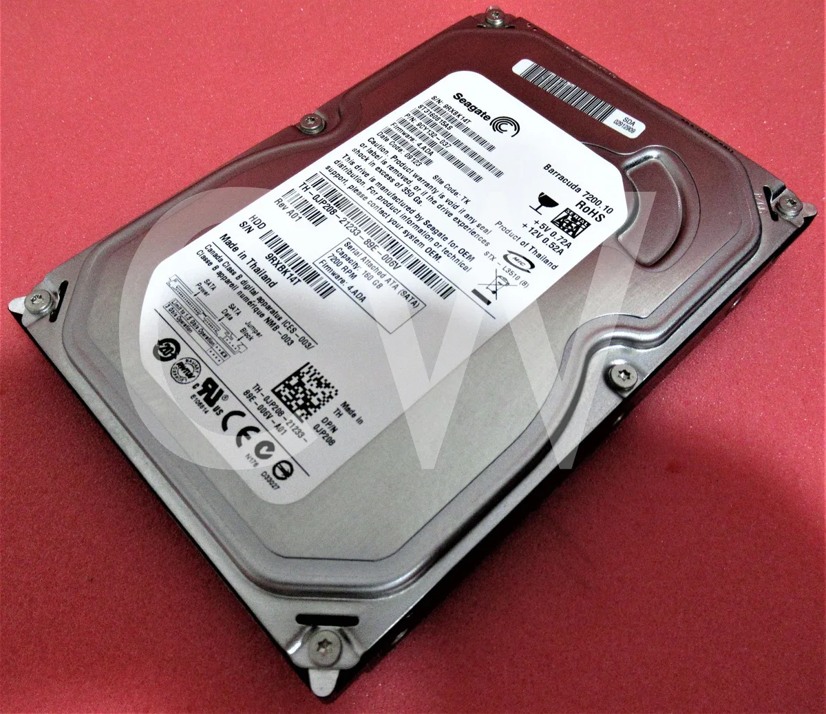 Silver 3.5 inch SATA hard drive with exposed circuit board