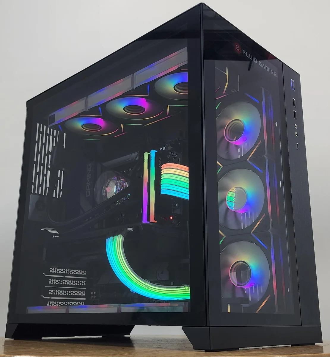 Black Lian Li O11 Dynamic case with 360mm AIO RGB cooler and RX 7900 XT graphics card