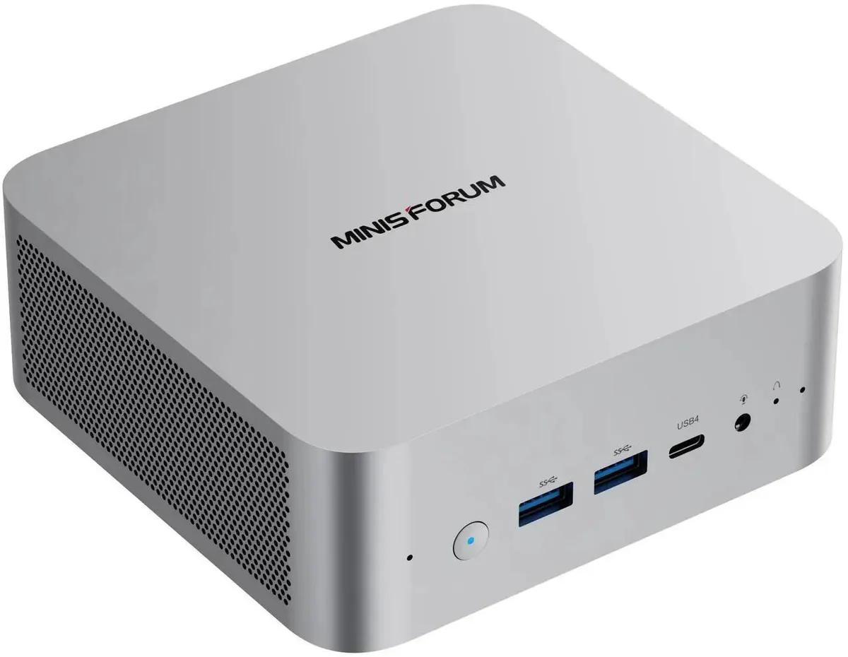 Silver compact mini PC with large side and bottom cooling vents
