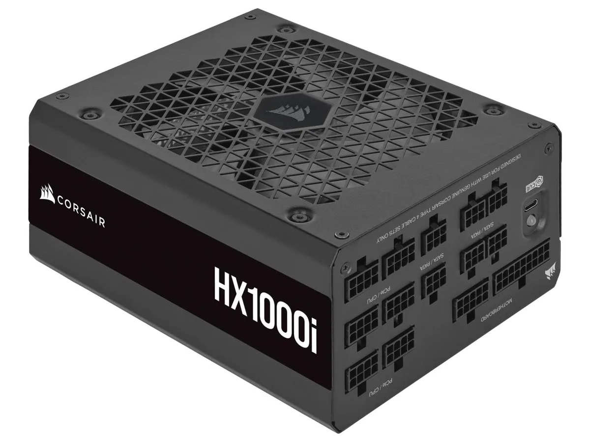 Black rectangular ATX power supply with modular cable ports and 140mm fan