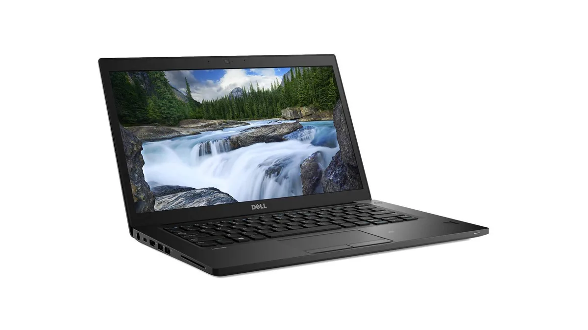 Silver 14 inch Dell Latitude 7490 laptop closed on a plain background