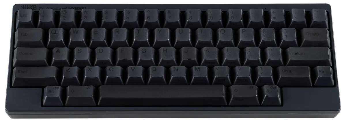 Compact 60% charcoal keyboard with textured PBT keycaps and Topre tactile switches