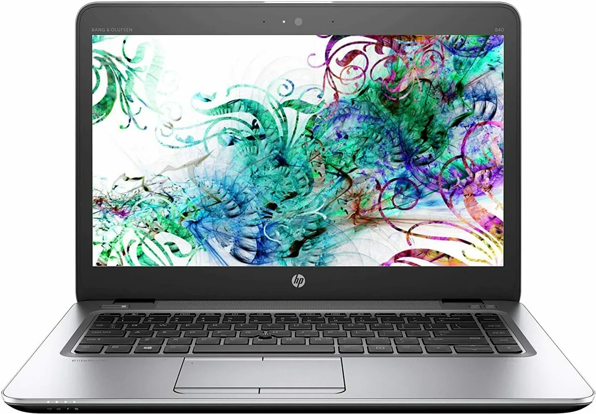 Silver 14 inch business laptop with backlit keyboard and fingerprint reader