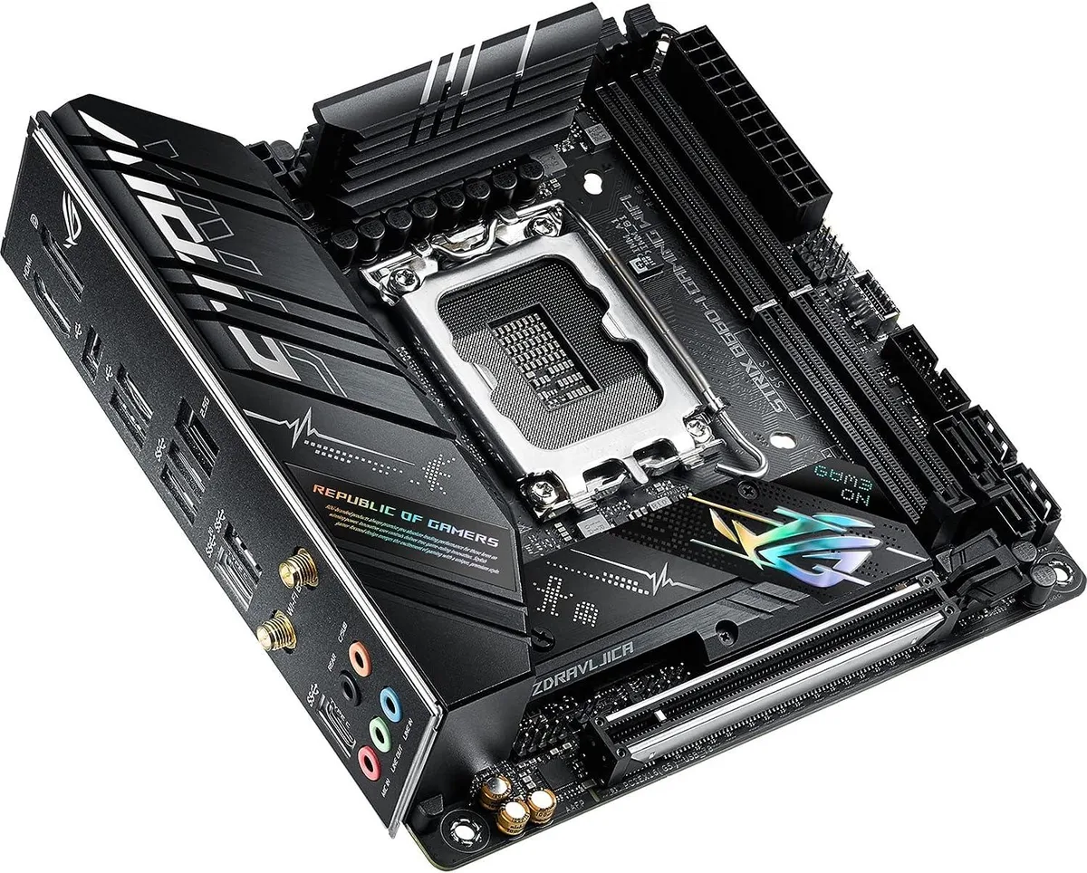 Compact Micro ATX motherboard with black PCB, silver heatsinks and rear I/O shield