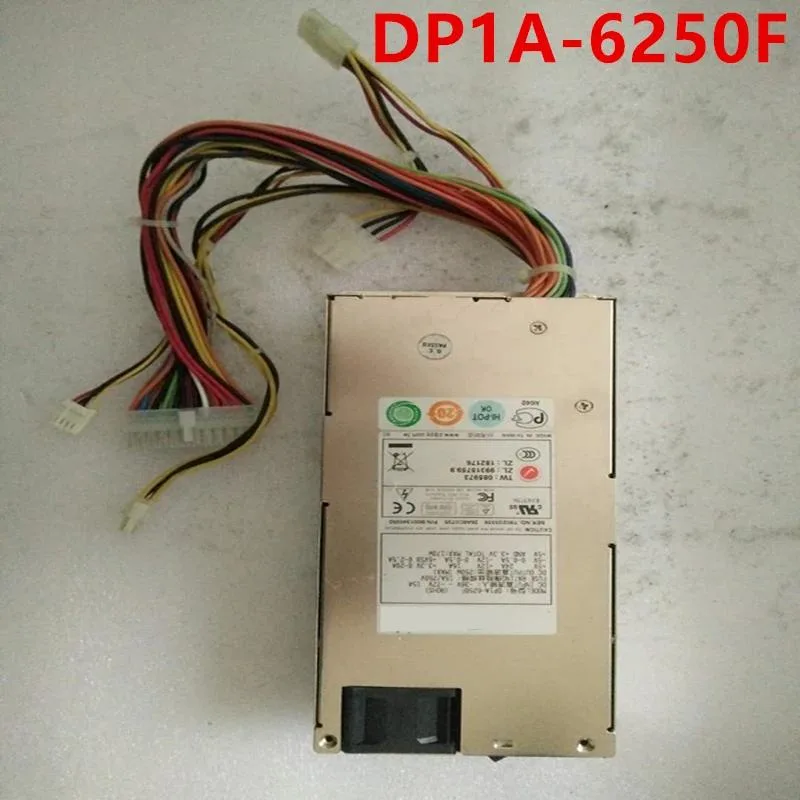 Silver rectangular ATX power supply unit with fan grille and cable bundle