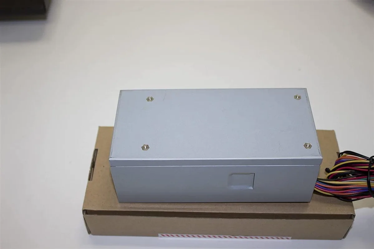 Compact TFX power supply unit with metal casing and rear fan grille
