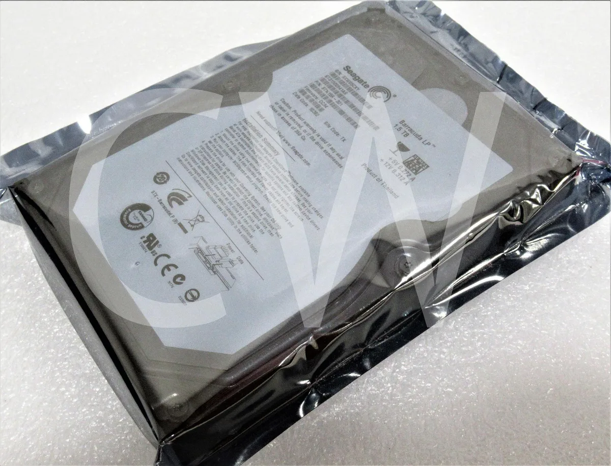 Silver 3.5 inch bare hard drive with circuit board visible
