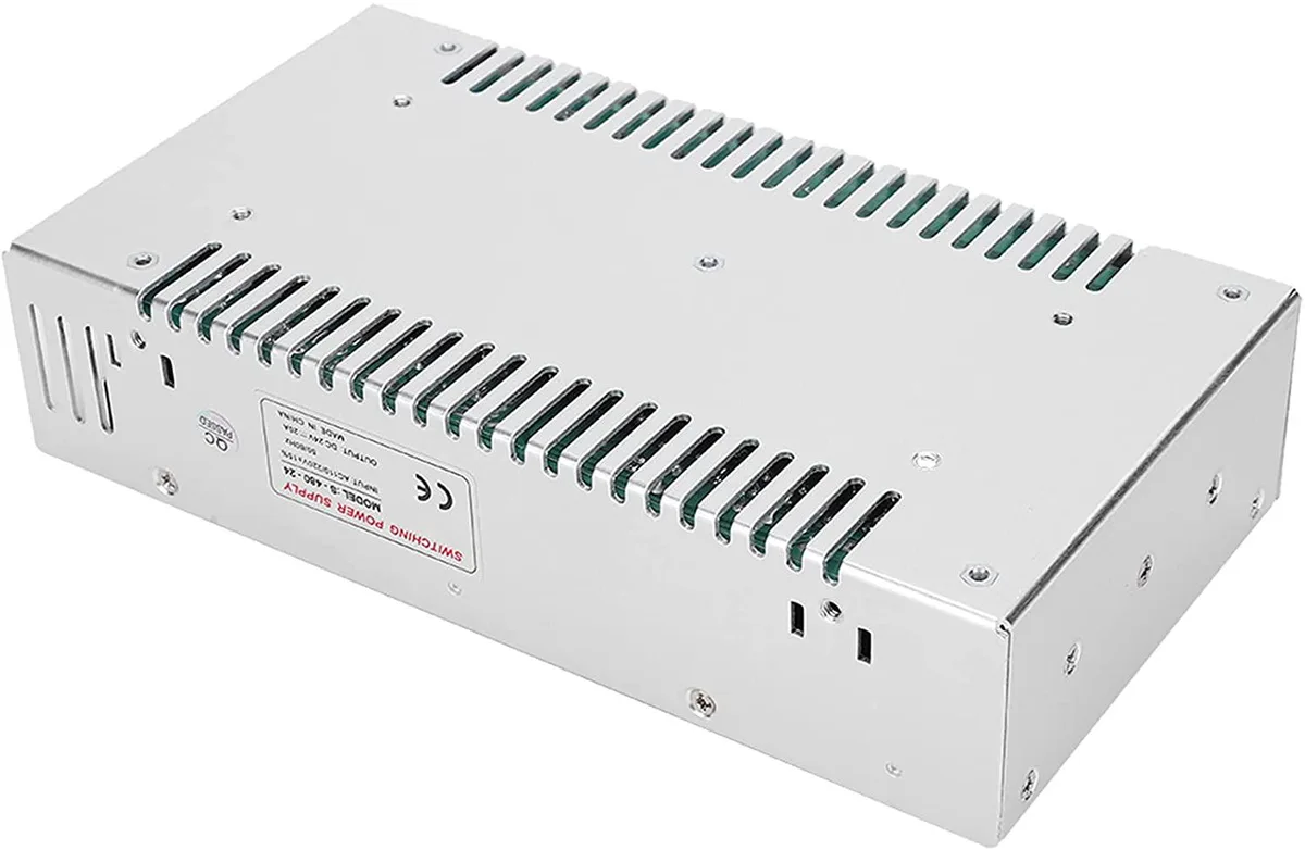 Pink aluminium switch-mode power supply unit, open-frame rectangular form, screw terminals visible