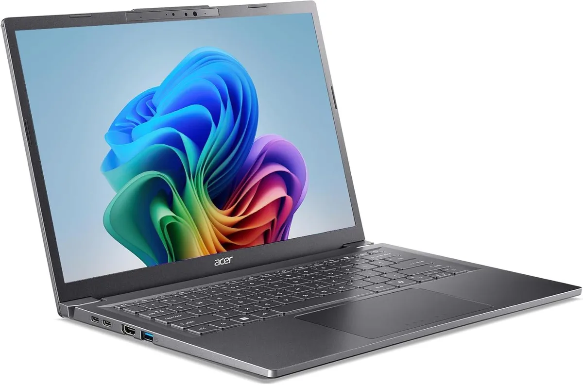 Silver-grey 14-inch laptop with thin bezels and backlit keyboard