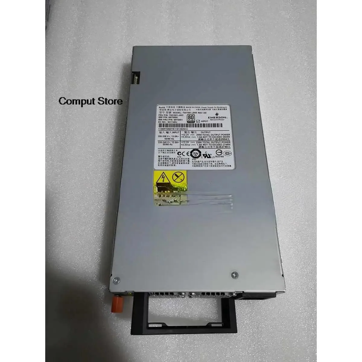 Rectangular ATX power supply unit in matte black finish with ventilation grille and multiple part number labels
