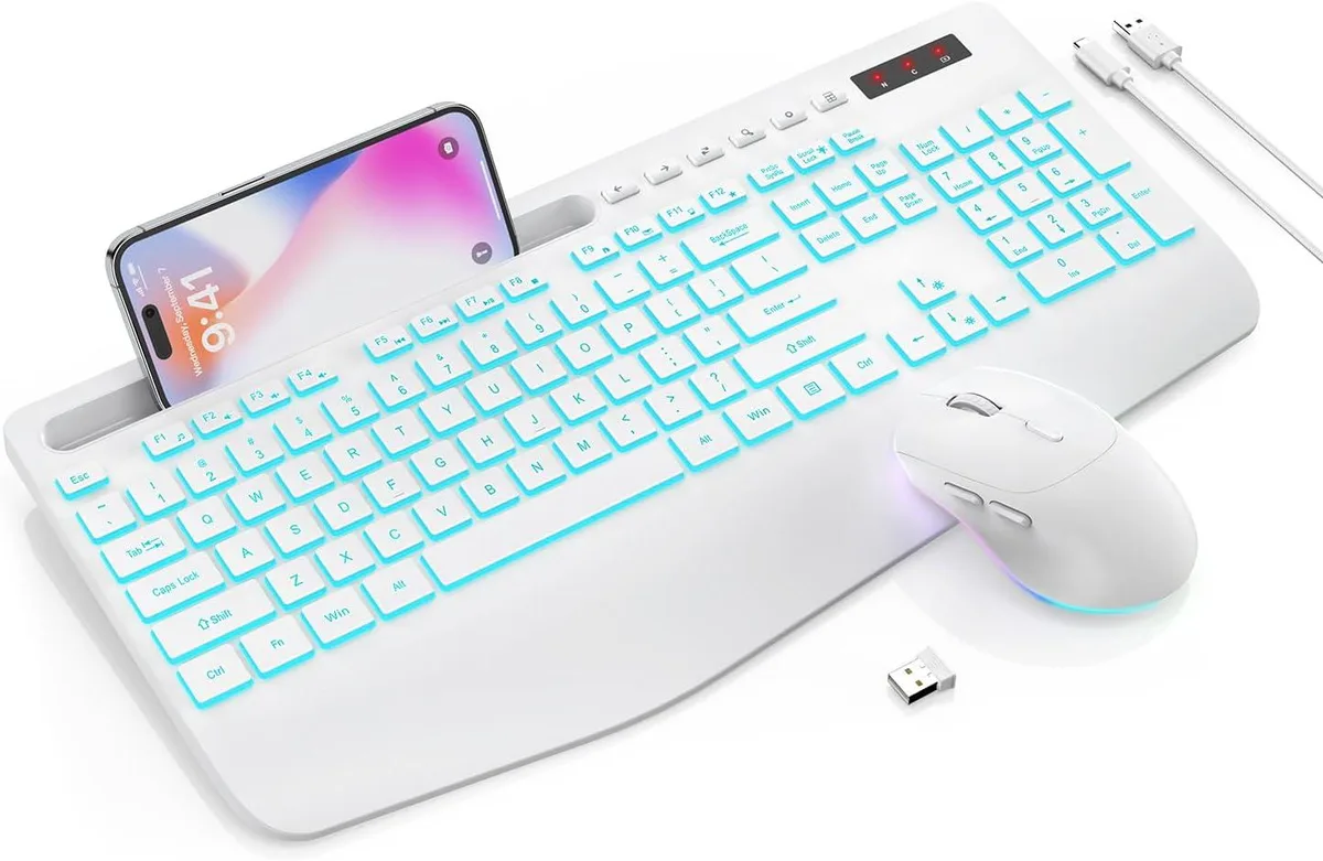 White full-size wireless keyboard with wrist rest and matching mouse, both backlit