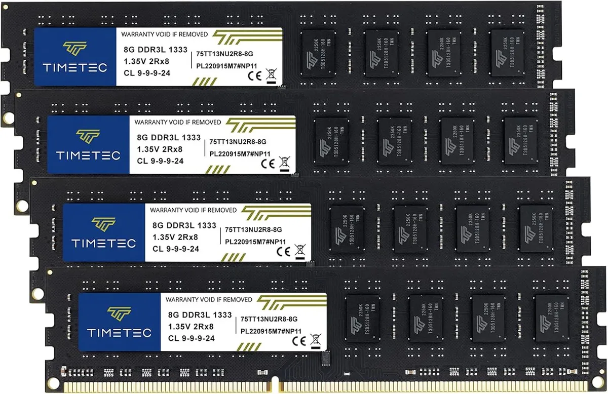 Four black DDR3 desktop memory modules side by side