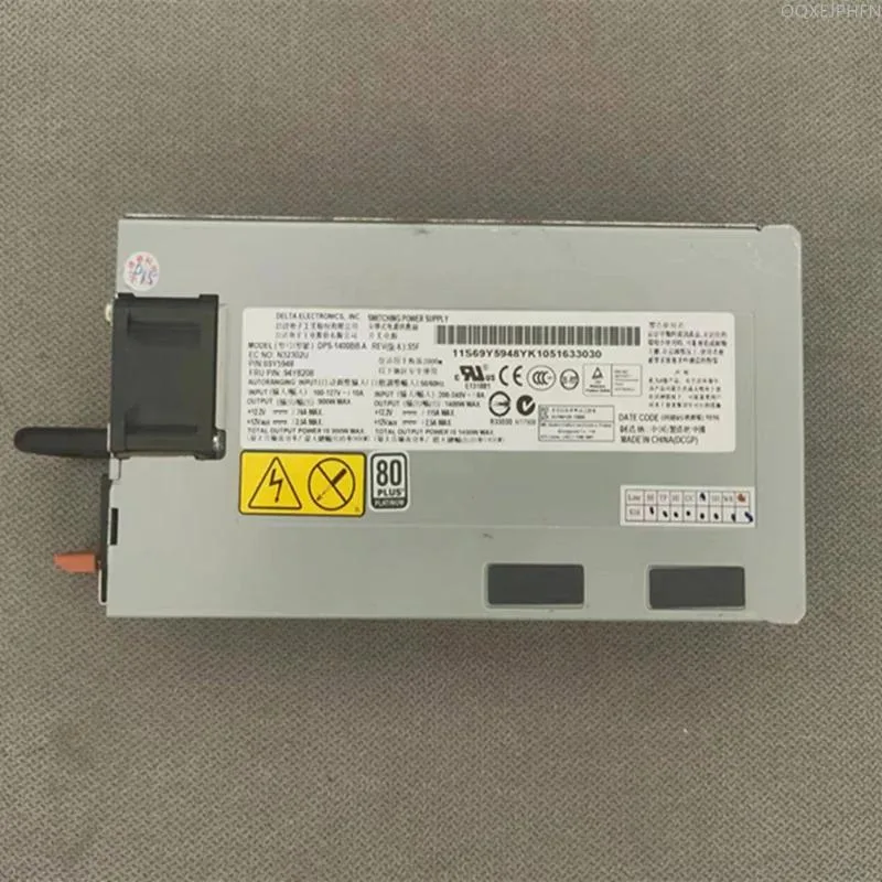 Rectangular silver metal power supply unit with ventilation grille and power socket