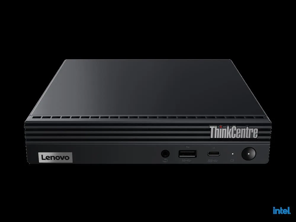 Tiny black desktop unit with wired keyboard and mouse