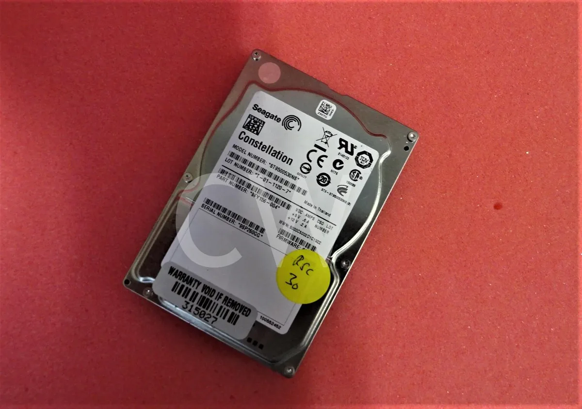 Silver rectangular 2.5 inch SATA hard drive with label showing model ST9500530NS