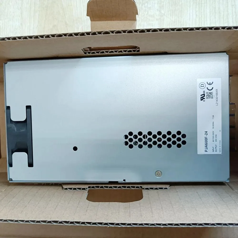Rectangular silver metal ATX power supply unit with ventilation grilles and label