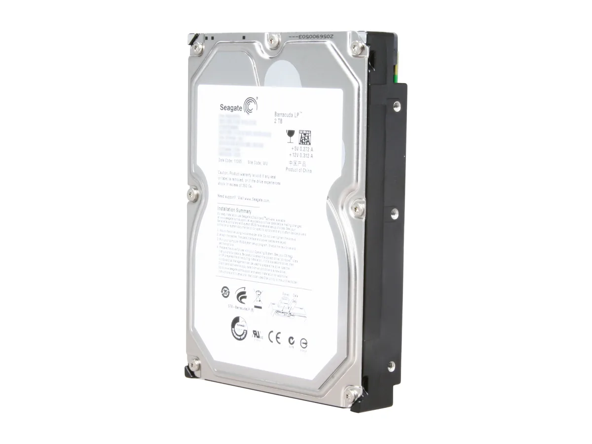 Silver 3.5 inch bare hard drive with green circuit board visible