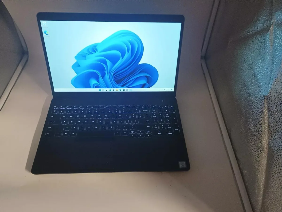 Silver Dell Precision 3540 laptop closed showing 15.6 inch display and keyboard