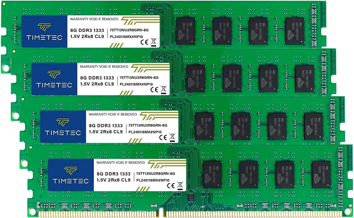 Four green DDR3 memory sticks with gold contacts