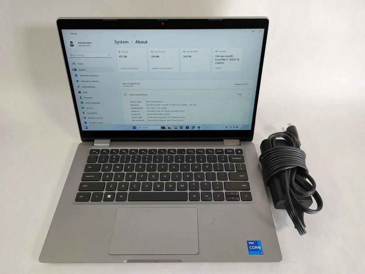 Silver 13.3 inch touchscreen laptop with scuffed lid and backlit keyboard