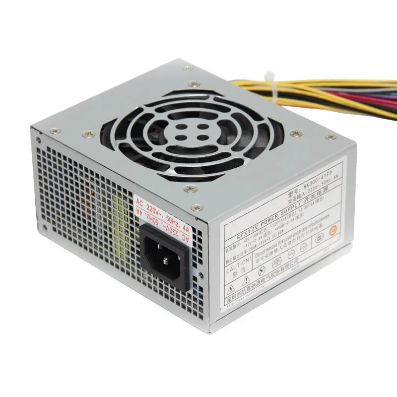 Small silver SFX power supply unit with fan grille and cable bundle