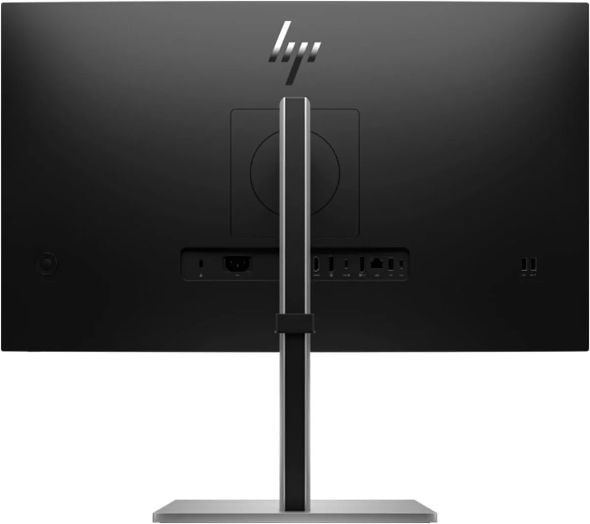 Silver laptop beside two 27 inch monitors on a dual stand with dock keyboard mouse webcam headphones gel pad and briefcase