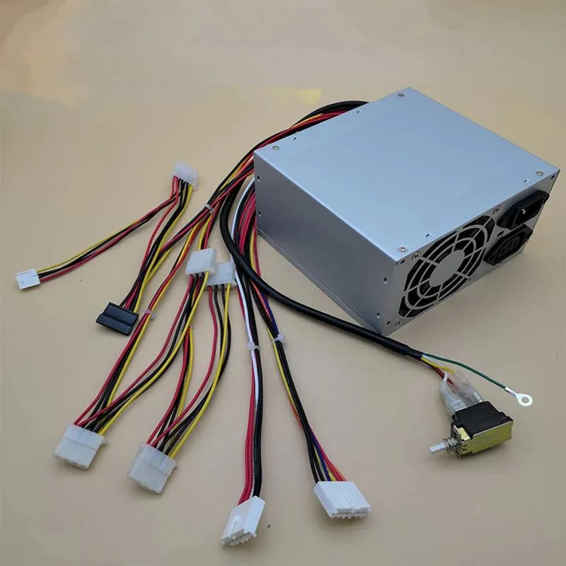 Rectangular black ATX power supply unit with cooling fan and cable bundle