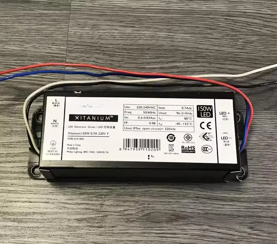 Rectangular metal power supply unit with label showing 150W 96-214V 0.7A
