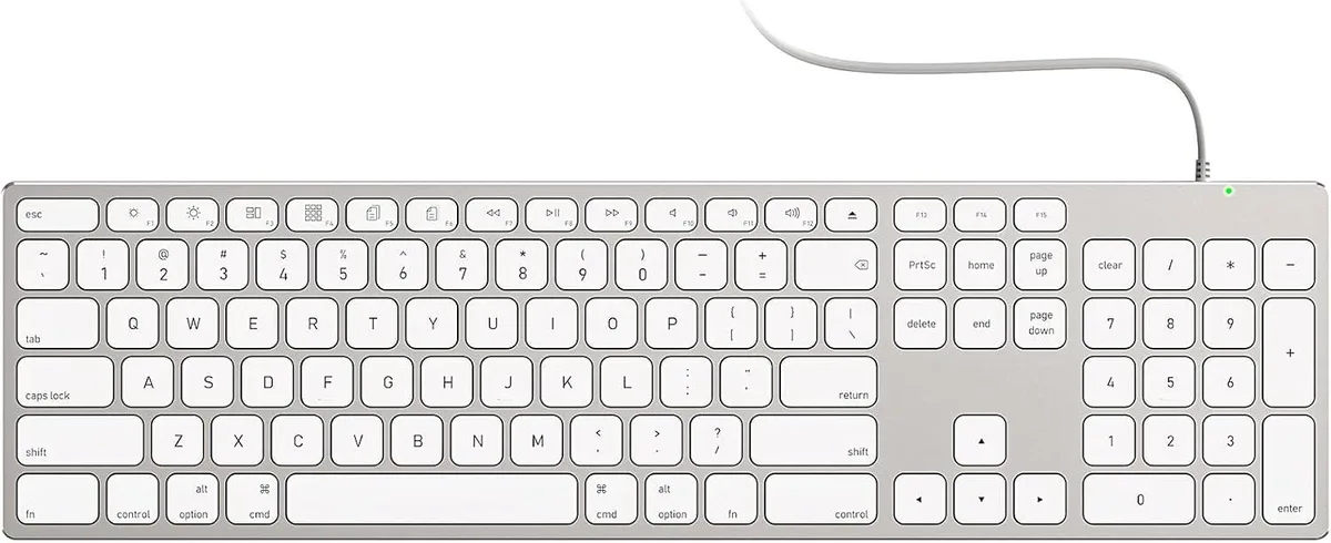 Silver all-aluminum full-size Mac keyboard with numeric keypad and stick-on risers