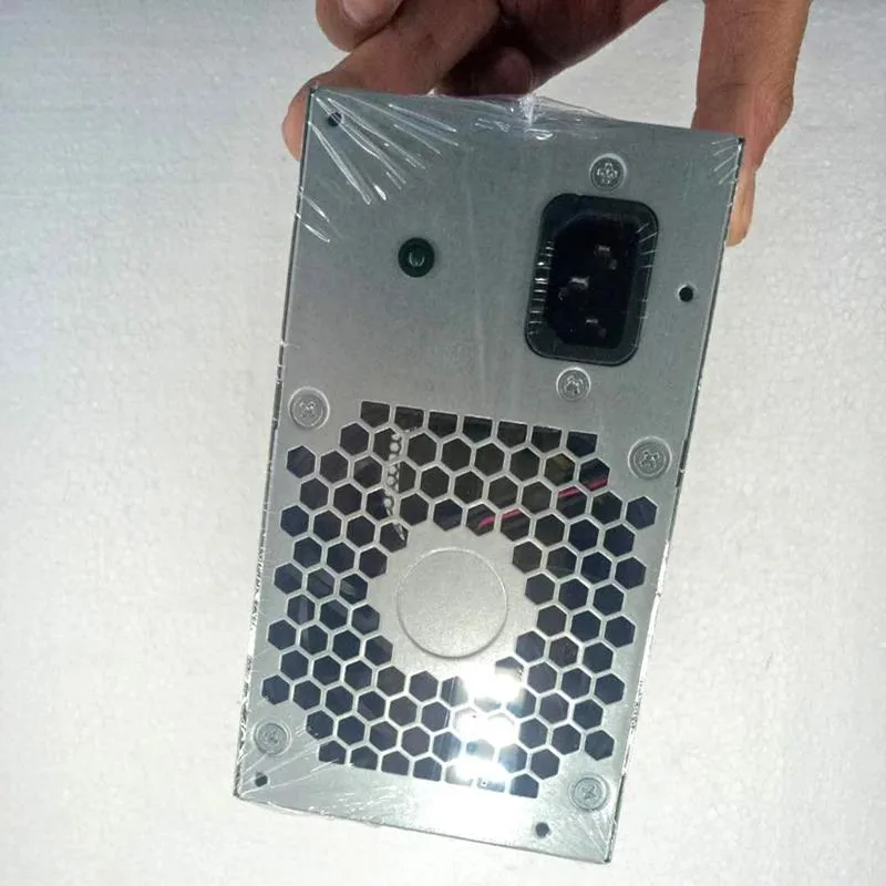 Rectangular silver ATX power supply unit with ventilation grille and label sticker