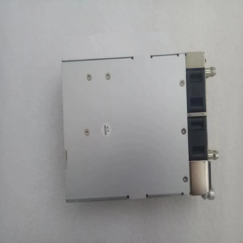Rectangular ATX power supply unit, matte black metal casing, cooling fan visible on one side, modular cable connectors on the rear
