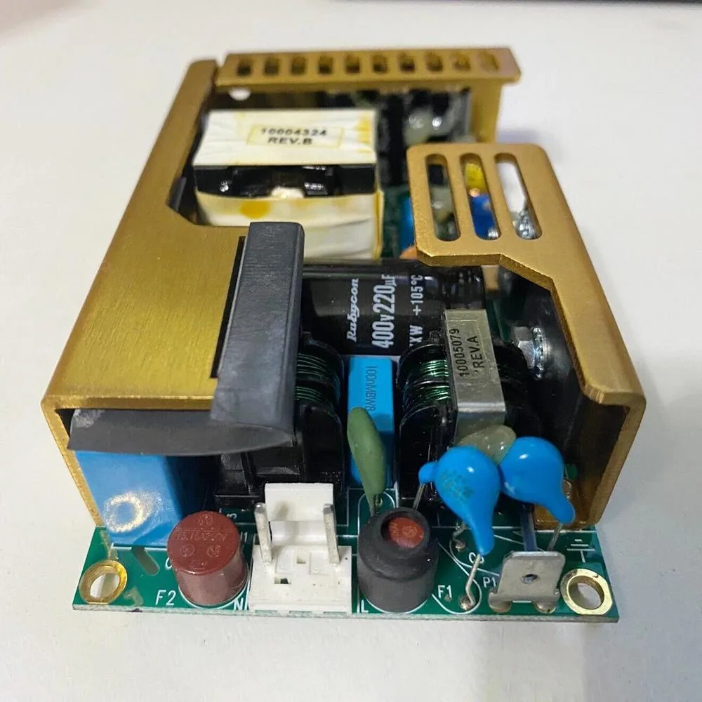 Rectangular ATX power supply unit with metal casing and label showing 24V 100W