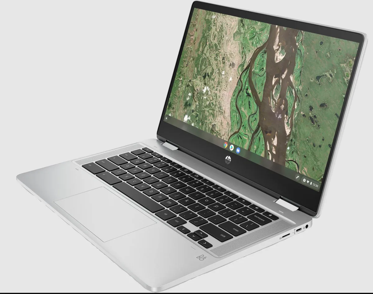Silver 14-inch convertible laptop with edge-to-edge glass touchscreen and 360-degree hinge
