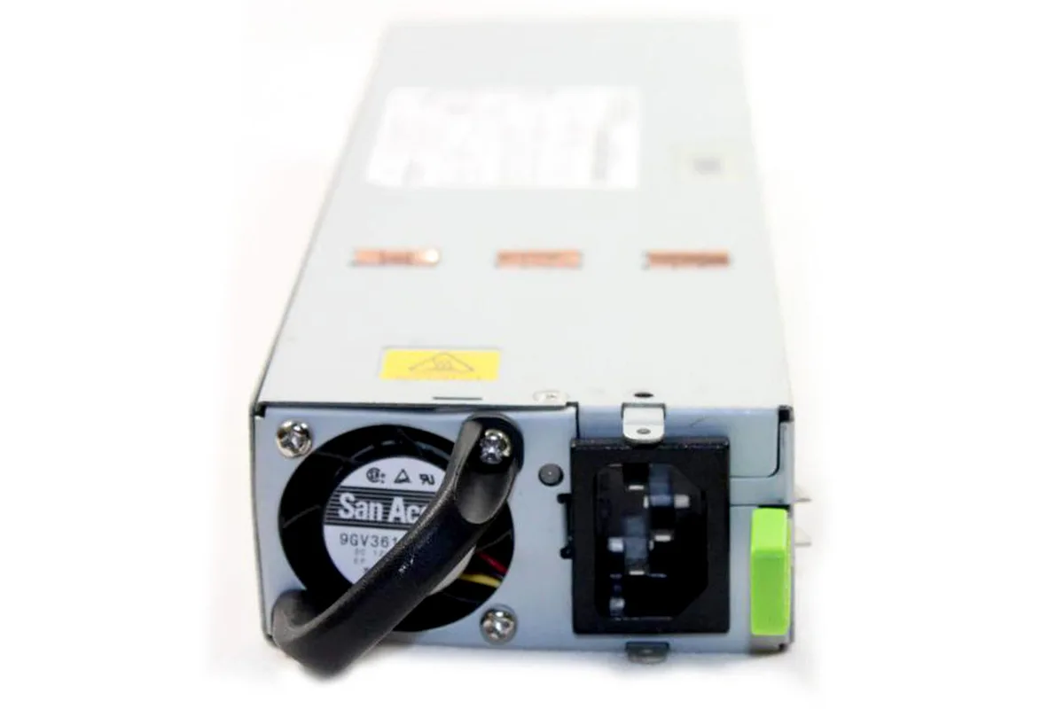 Rectangular silver metal power supply unit with ventilation grilles and label showing model DS1050-3-001