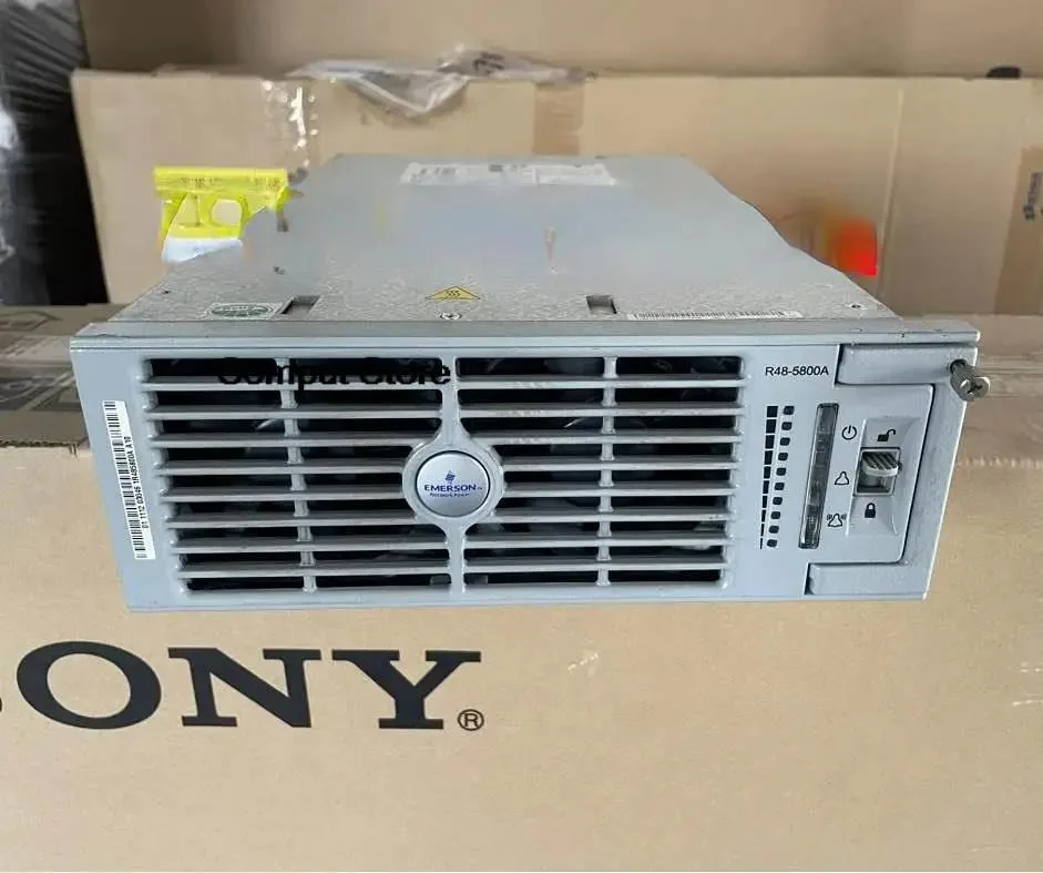 Rectangular silver metal power supply module with front handle and ventilation slots
