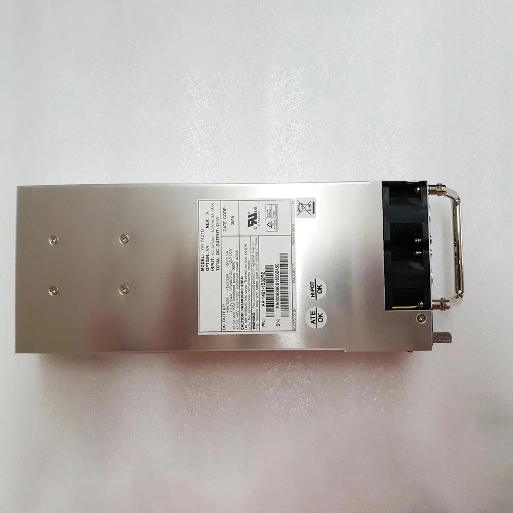 Rectangular silver ATX power supply unit with ventilation grille and label showing model numbers