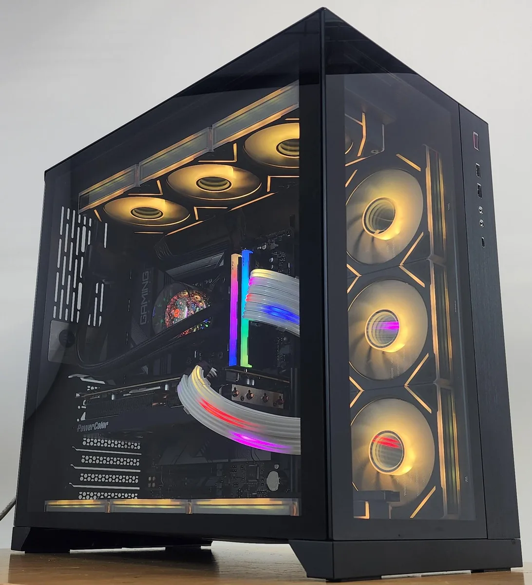 Black Lian Li O11 Dynamic ATX case with 360mm AIO RGB cooler and RX 7800 XT graphics card visible through glass side panel